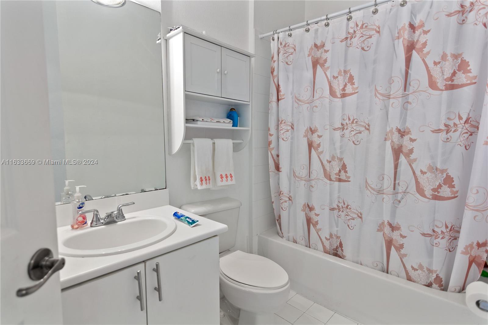 11051 Southwest 246th Street Homestead, FL 33032 - Photo 21 of 30 a bathroom with a sink toilet and a mirror