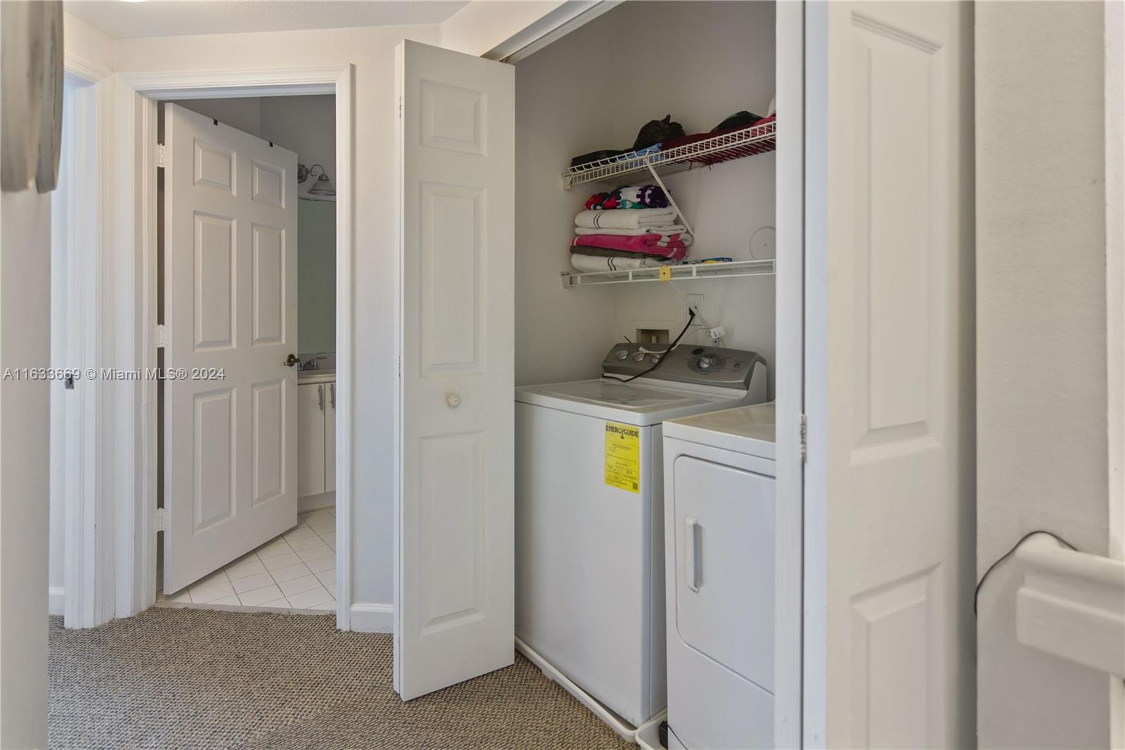 11051 Southwest 246th Street Homestead, FL 33032 - Photo 22 of 30 a storage room with wooden floor washer and dryer