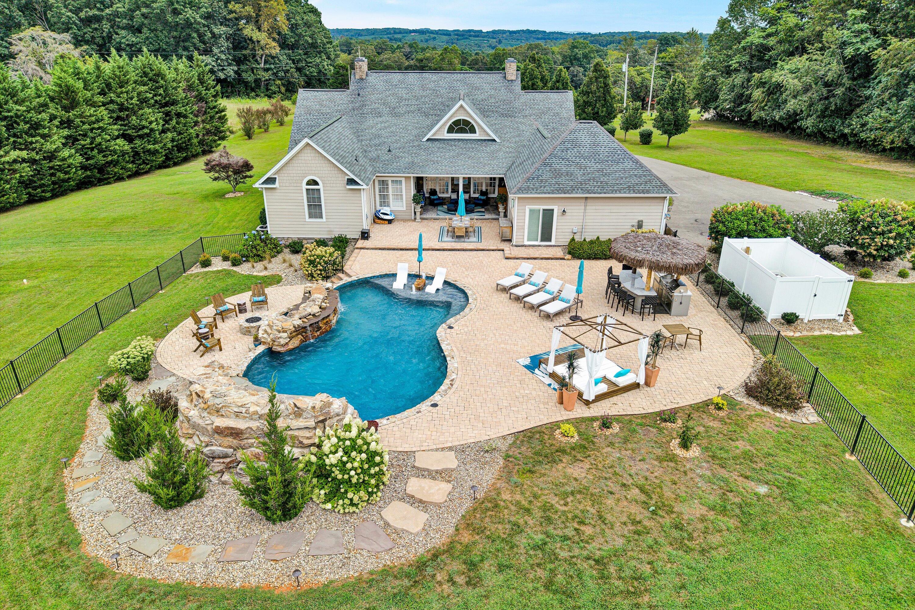 an aerial view of a house with outdoor space