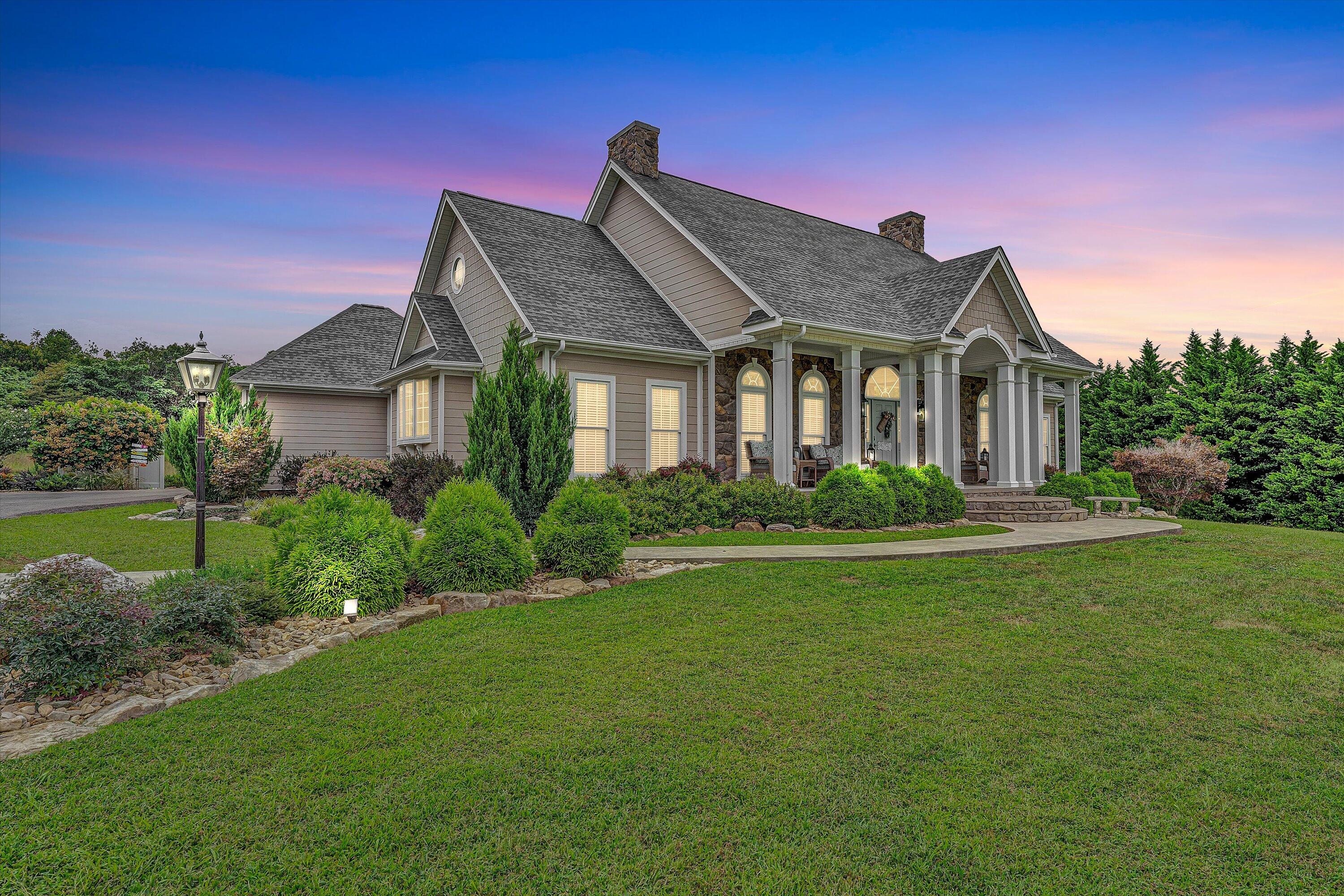 a front view of a house with a yard