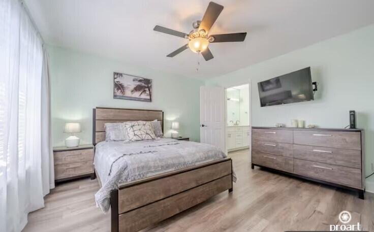186 Durango Road Destin, FL 32541 - Photo 14 of 29 a bedroom with a bed and a flat screen tv