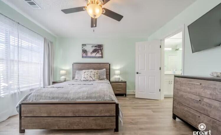 186 Durango Road Destin, FL 32541 - Photo 15 of 29 a bedroom with a bed and a flat screen tv