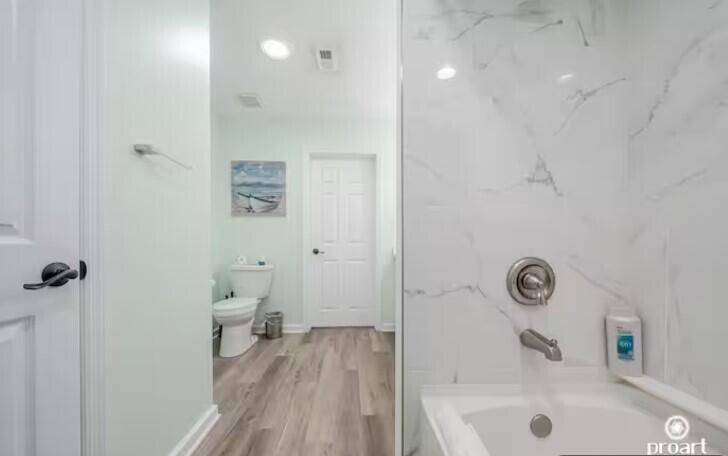 186 Durango Road Destin, FL 32541 - Photo 16 of 29 a bathroom with a bathtub and a toilet