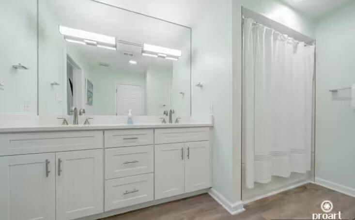 186 Durango Road Destin, FL 32541 - Photo 18 of 29 a bathroom with a double vanity sink and mirror