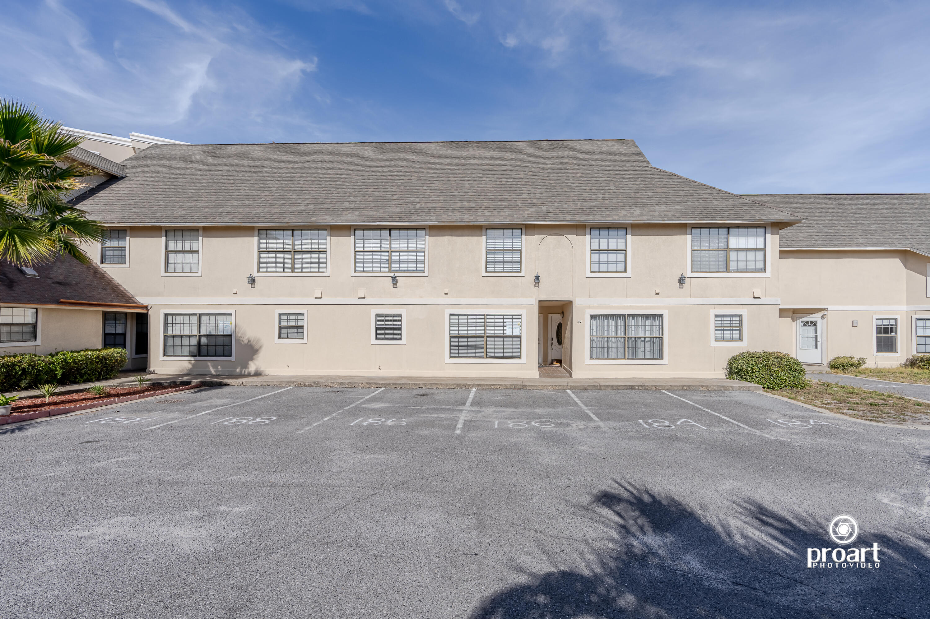186 Durango Road Destin, FL 32541 - Photo 23 of 29 a front view of a house with a yard and garage