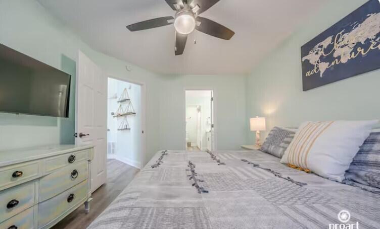 186 Durango Road Destin, FL 32541 - Photo 9 of 29 a spacious bedroom with a bed and a flat screen tv
