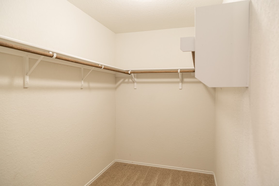 15225 Harkness Pass Austin, TX 78725 - Photo 12 of 23 a view of an empty walk in closet