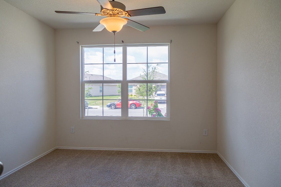 15225 Harkness Pass Austin, TX 78725 - Photo 13 of 23 an empty room with a window