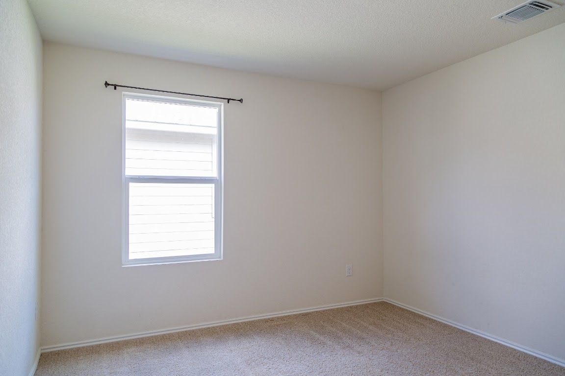 15225 Harkness Pass Austin, TX 78725 - Photo 19 of 23 an empty room with a window