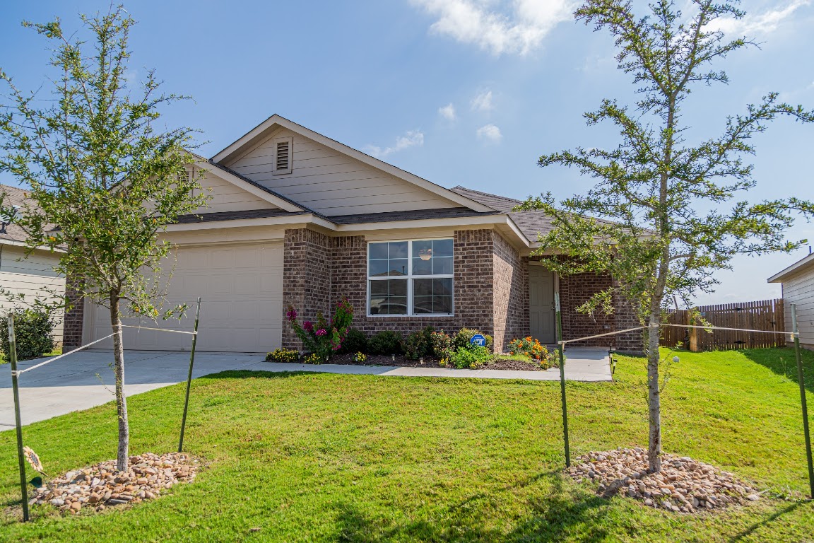 15225 Harkness Pass Austin, TX 78725 - Photo 2 of 23 a house view with a garden space