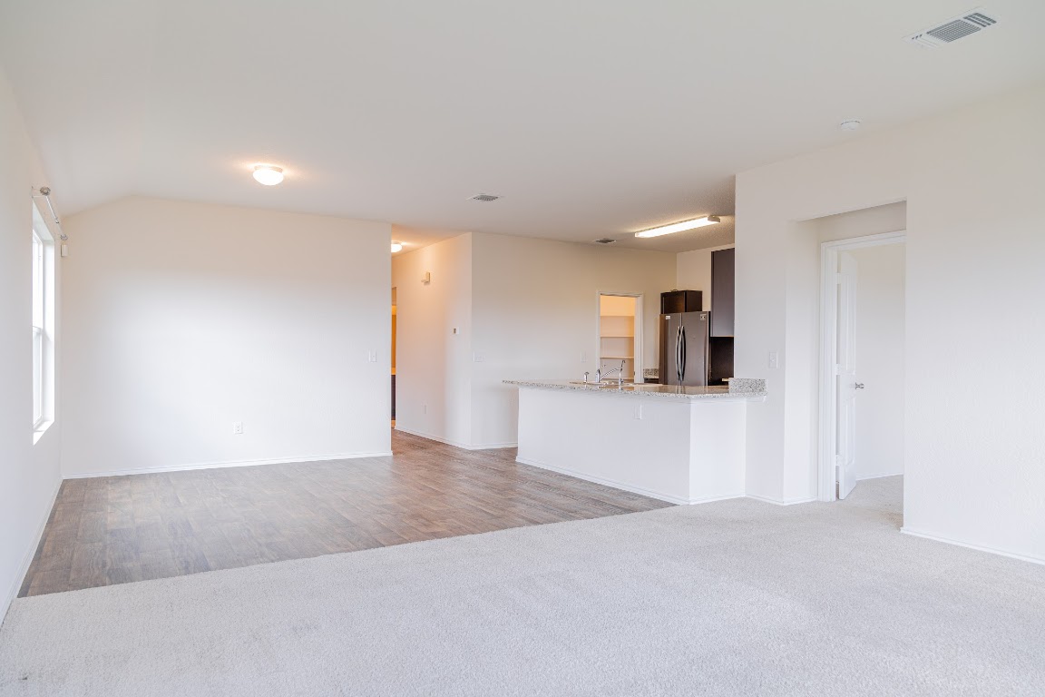 15225 Harkness Pass Austin, TX 78725 - Photo 6 of 23 a view of kitchen with refrigerator and window