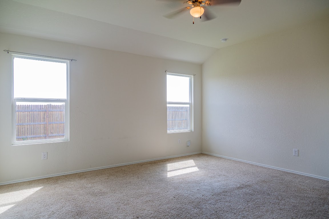 15225 Harkness Pass Austin, TX 78725 - Photo 10 of 23 an empty room with a window