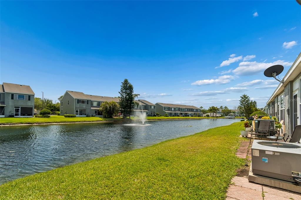 382 Countryside Key Boulevard Oldsmar, FL 34677 - Photo 40 of 58 a view of a swimming pool with an ocean view