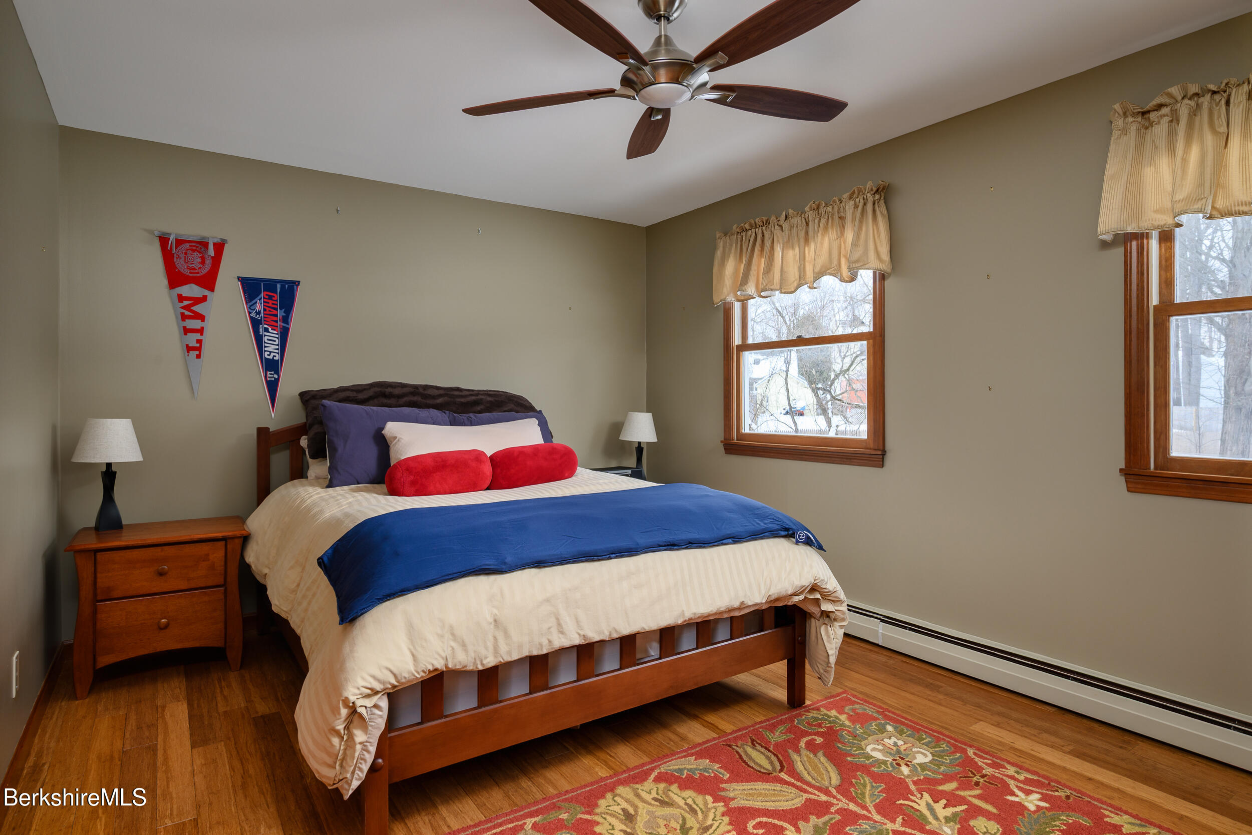 32 Marcella Way Dalton, MA 01226 - Photo 15 of 21 a bedroom with a bed next to a window and a lamp
