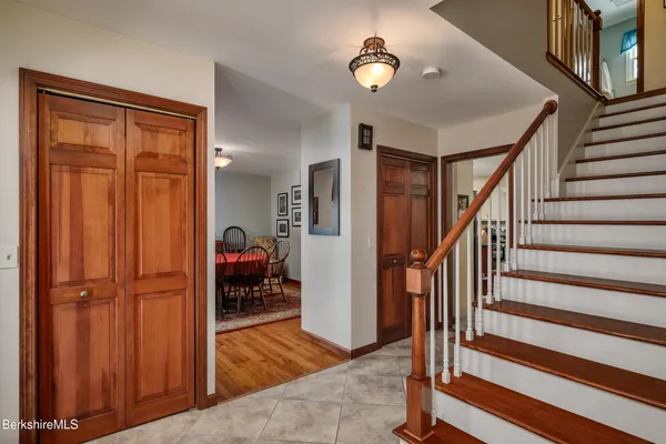 a view of a livingroom with furniture and hardwood floor