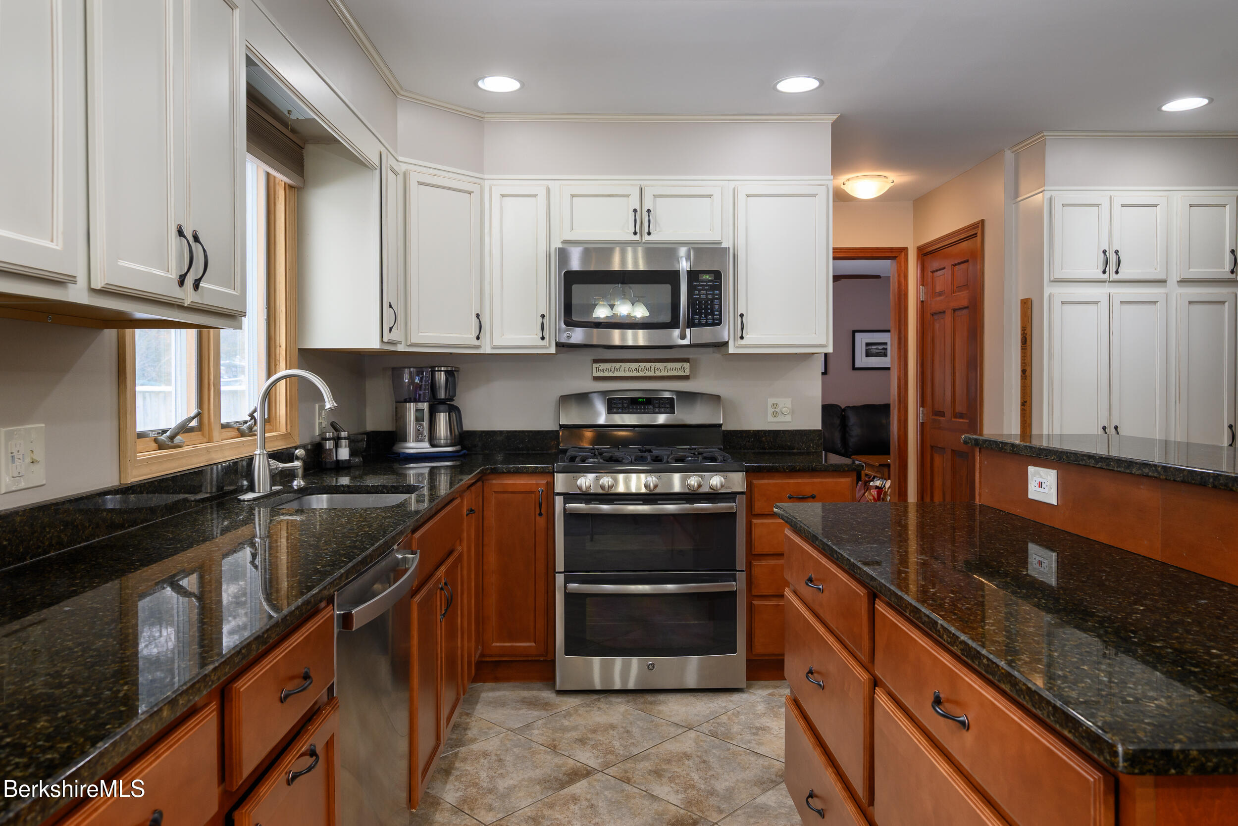 32 Marcella Way Dalton, MA 01226 - Photo 3 of 21 a kitchen with stainless steel appliances granite countertop a stove top oven a sink and a granite counter top
