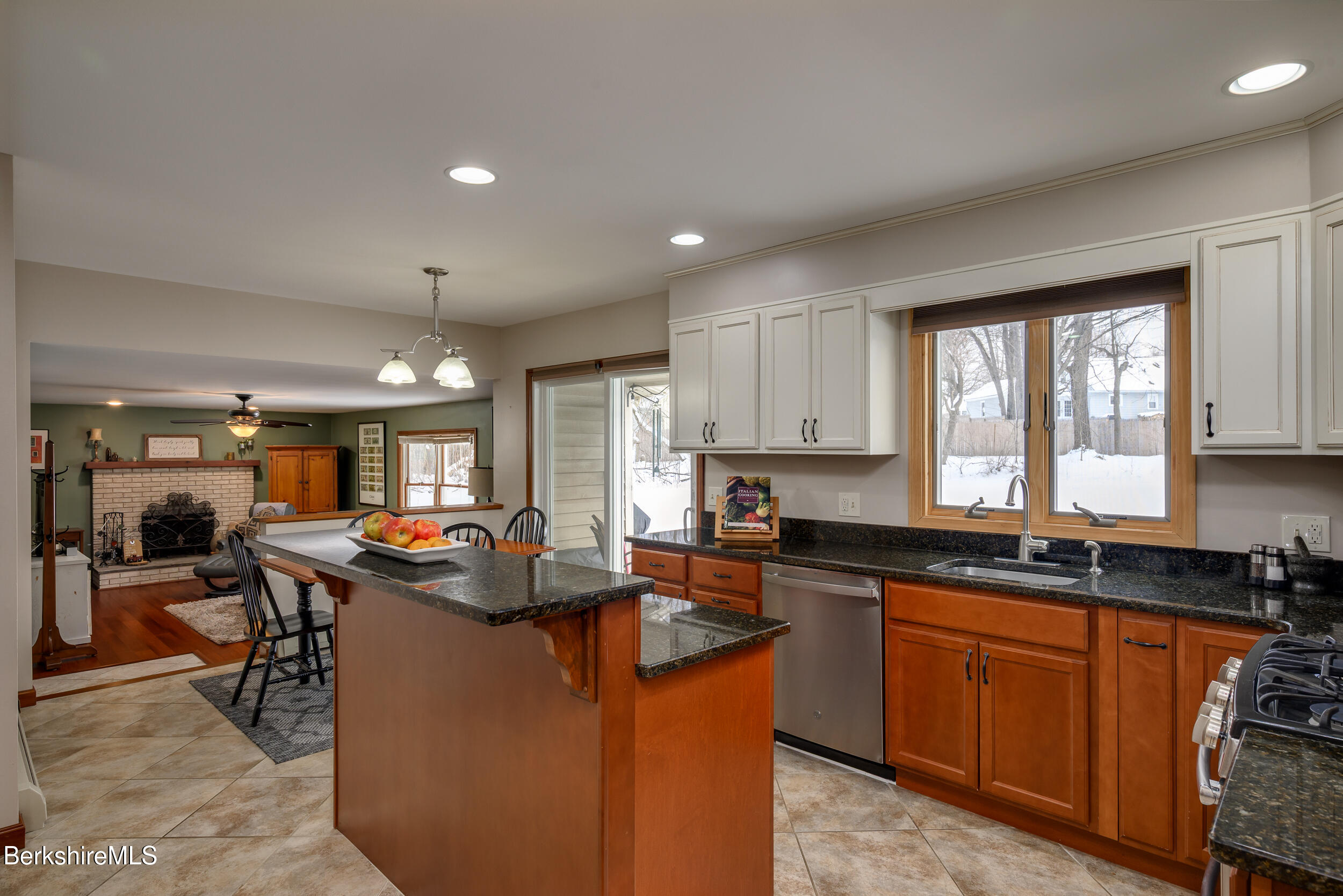 32 Marcella Way Dalton, MA 01226 - Photo 5 of 21 a kitchen with kitchen island granite countertop a sink stove and cabinets