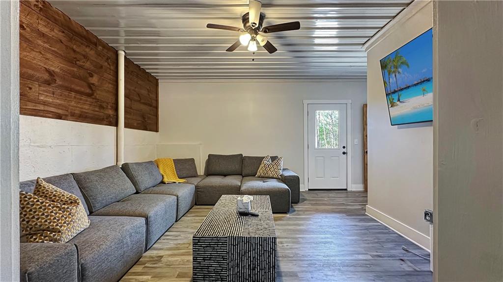 374 Prince Drive Morganton, GA 30560 - Photo 23 of 51 a living room with furniture and wooden floor
