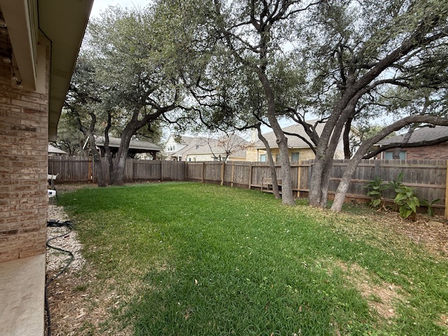 3717 Tall Cedars Road Cedar Park, TX 78613 - Photo 14 of 22 a view of a backyard with large trees
