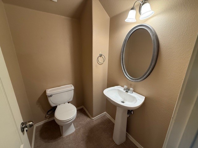 3717 Tall Cedars Road Cedar Park, TX 78613 - Photo 20 of 22 a bathroom with a toilet sink and a mirror