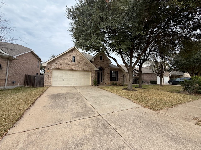 3717 Tall Cedars Road Cedar Park, TX 78613 - Photo 2 of 22 a front view of a house with a yard and garage