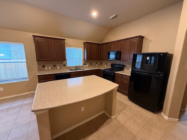 3717 Tall Cedars Road Cedar Park, TX 78613 - Photo 4 of 22 a kitchen with stainless steel appliances a refrigerator sink and microwave