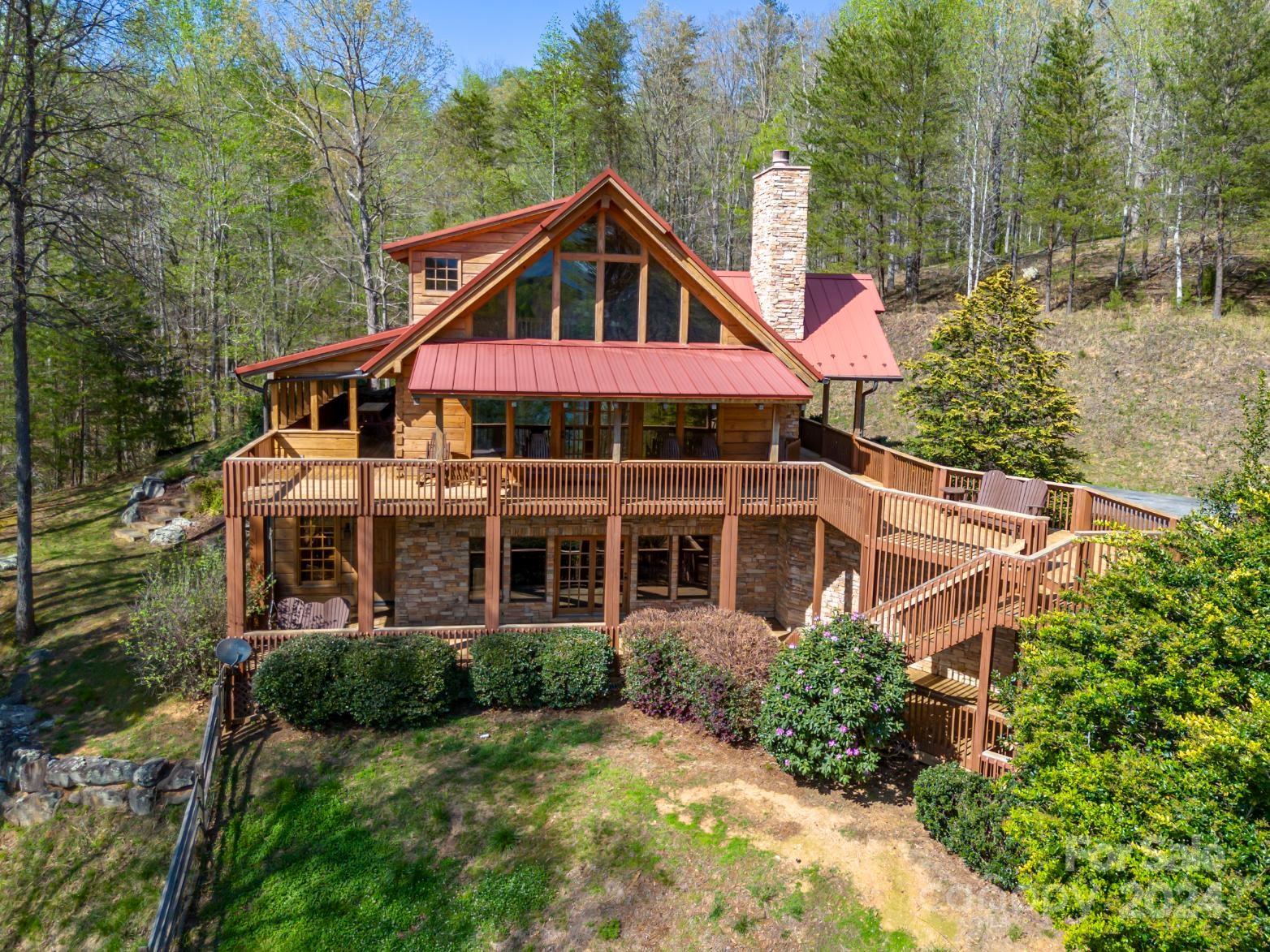 778 Pkwy N Road Mill Spring, NC 28756 - Photo 1 of 48 a front view of a house with yard and green space