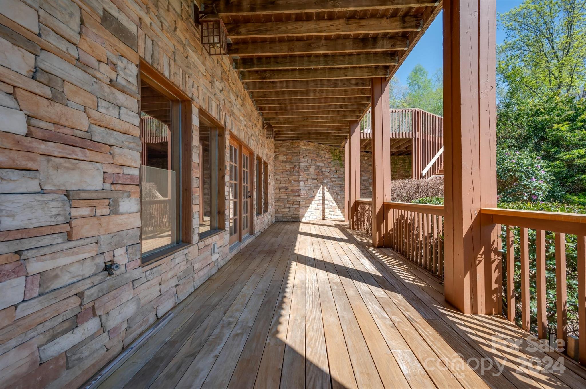 778 Pkwy N Road Mill Spring, NC 28756 - Photo 13 of 48 a view of balcony with wooden floor