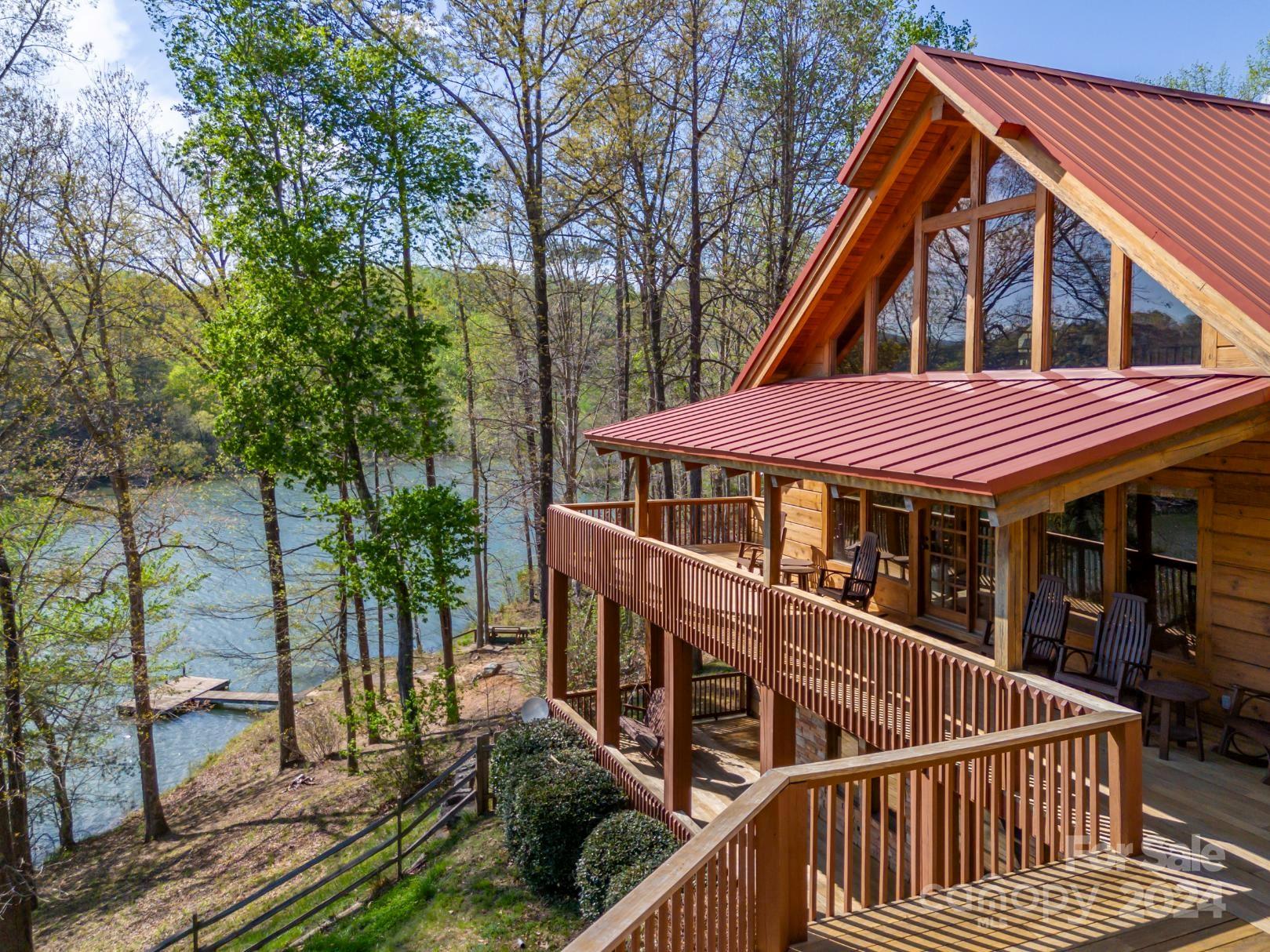 778 Pkwy N Road Mill Spring, NC 28756 - Photo 17 of 48 a view of house with a deck and furniture