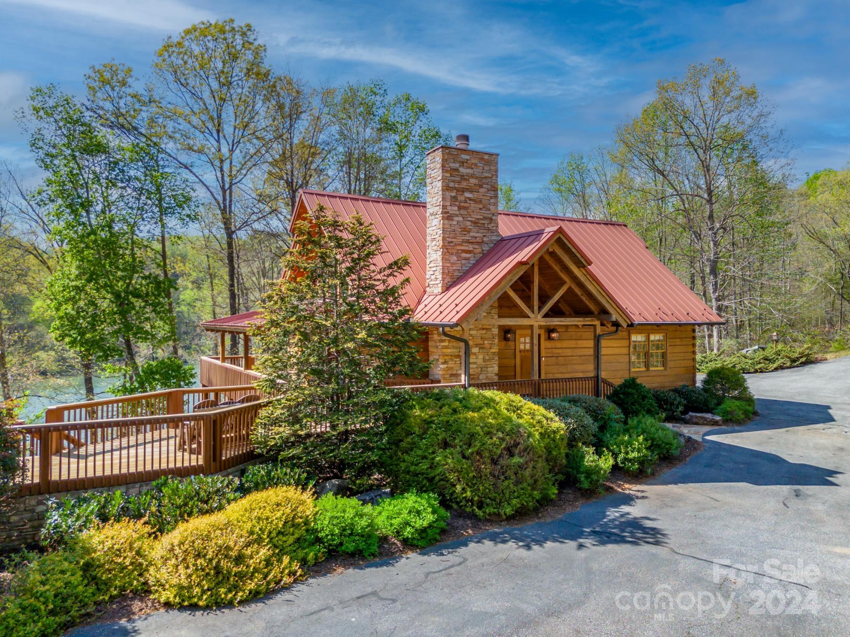 778 Pkwy N Road Mill Spring, NC 28756 - Photo 2 of 48 a front view of a house with a garden