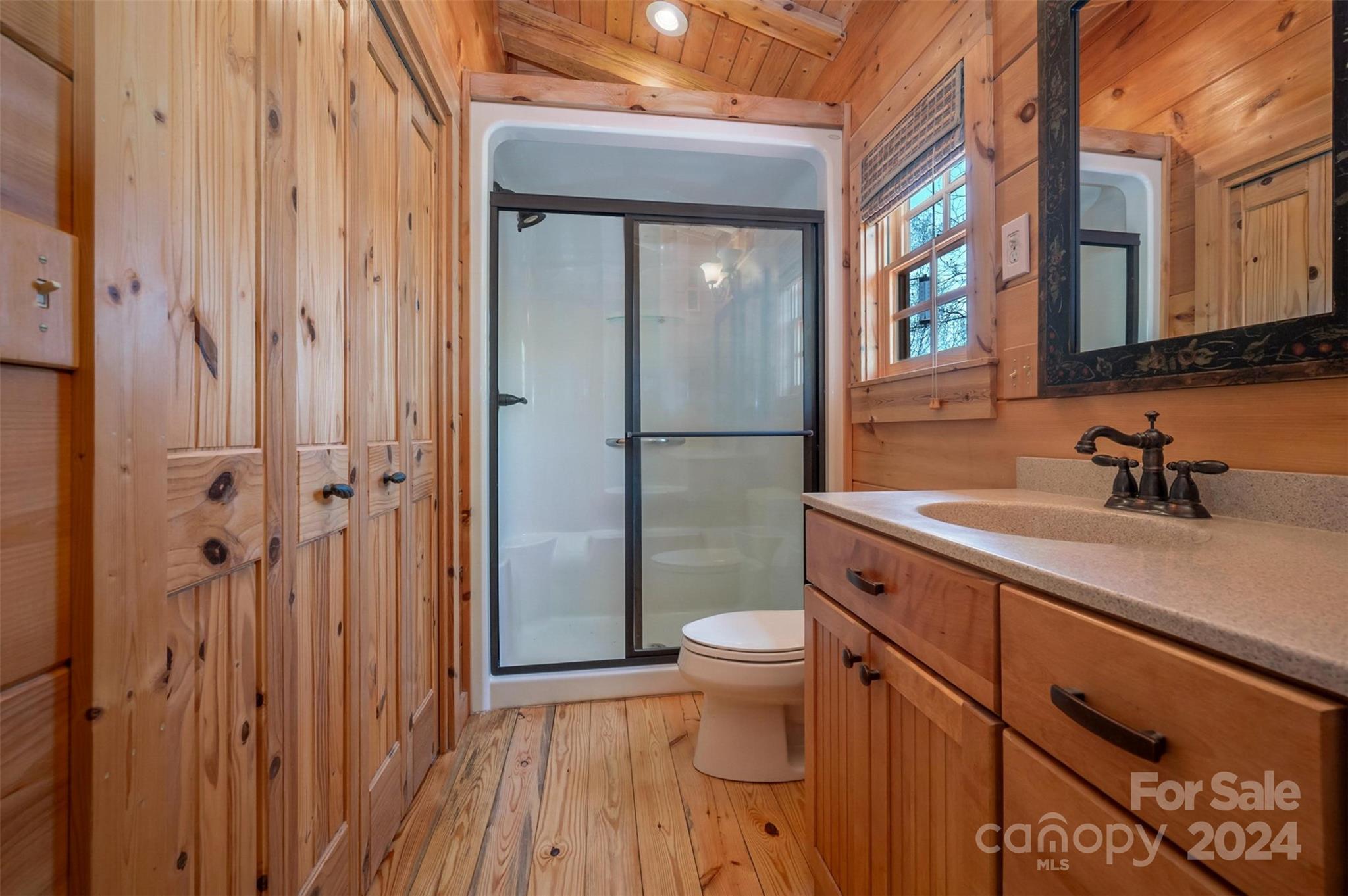 778 Pkwy N Road Mill Spring, NC 28756 - Photo 25 of 48 a bathroom with a sink a toilet and shower