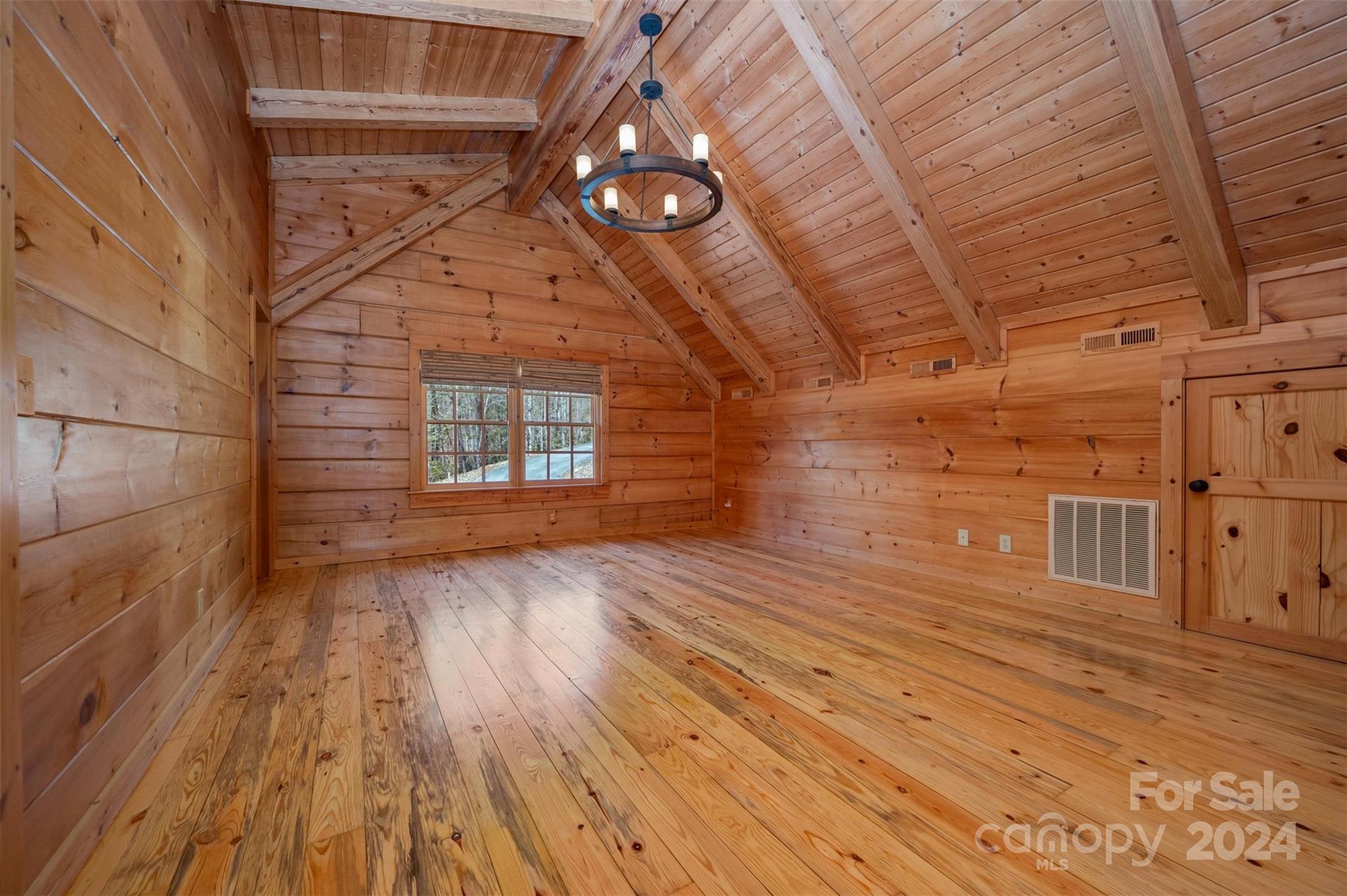 778 Pkwy N Road Mill Spring, NC 28756 - Photo 27 of 48 a view of an empty room with wooden floor and a window