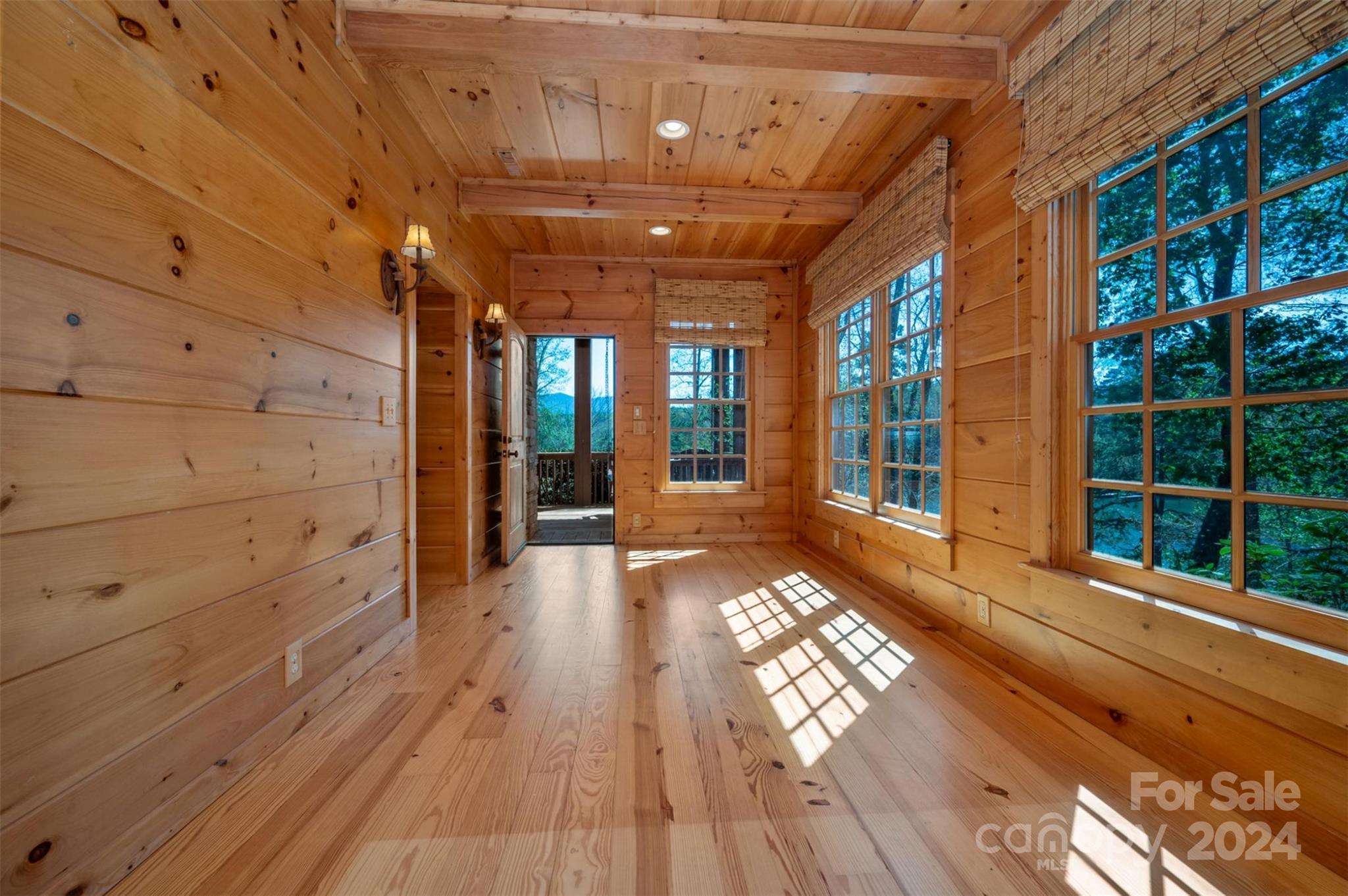 778 Pkwy N Road Mill Spring, NC 28756 - Photo 31 of 48 a view of a porch with wooden floor and windows