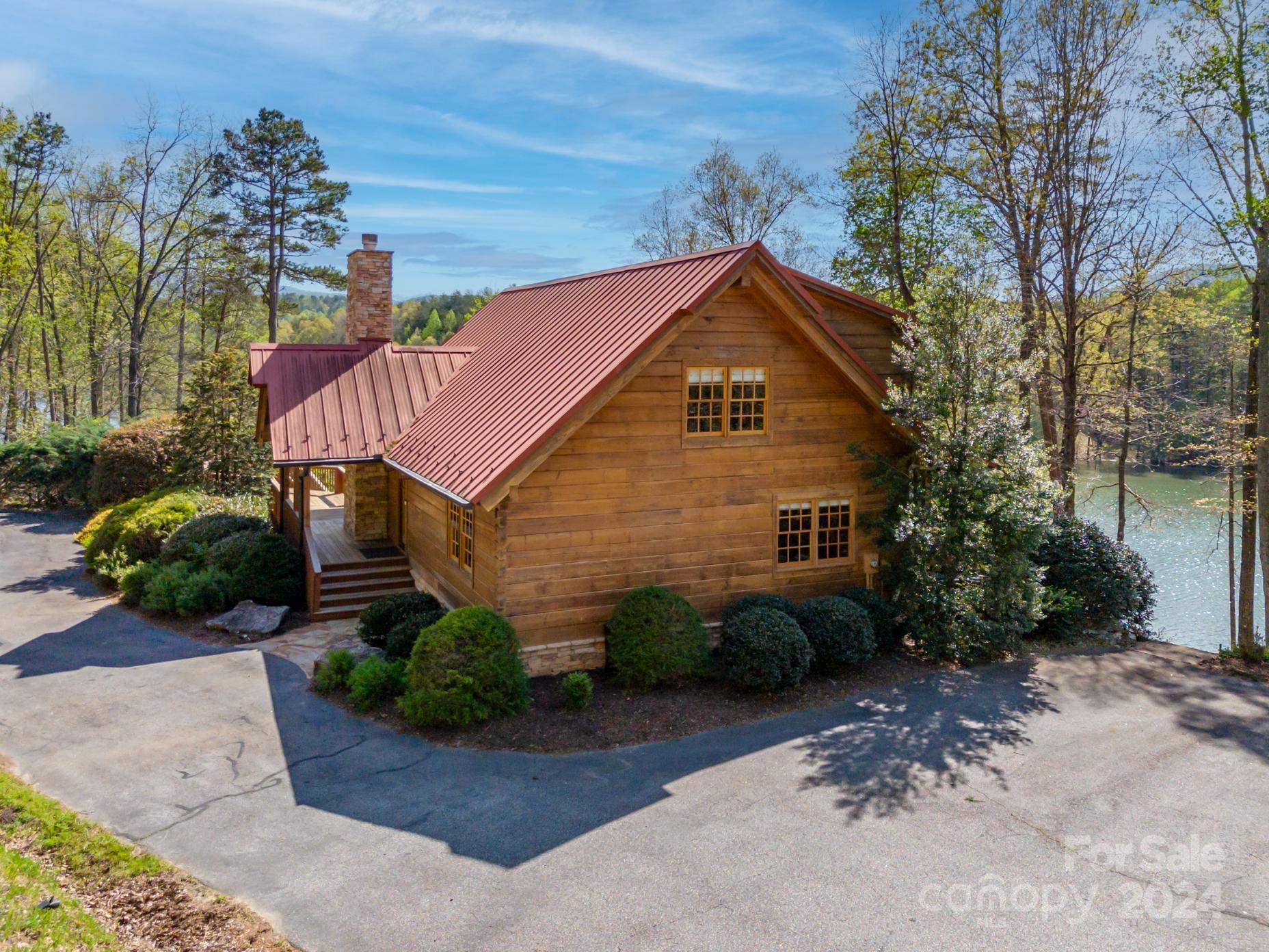 778 Pkwy N Road Mill Spring, NC 28756 - Photo 41 of 48 a front view of a house with garden