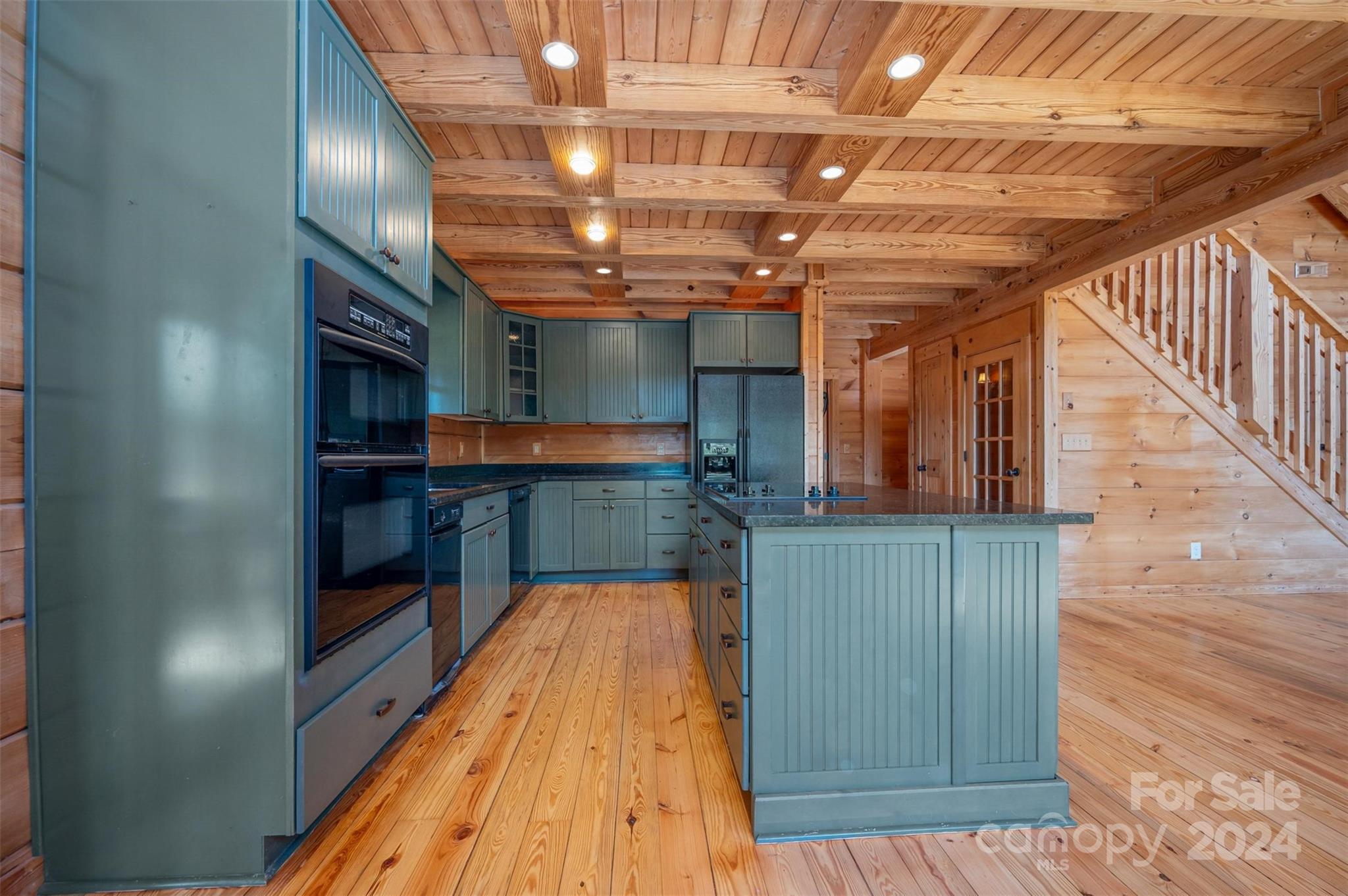 778 Pkwy N Road Mill Spring, NC 28756 - Photo 43 of 48 a view of kitchen with cabinets and wooden floor