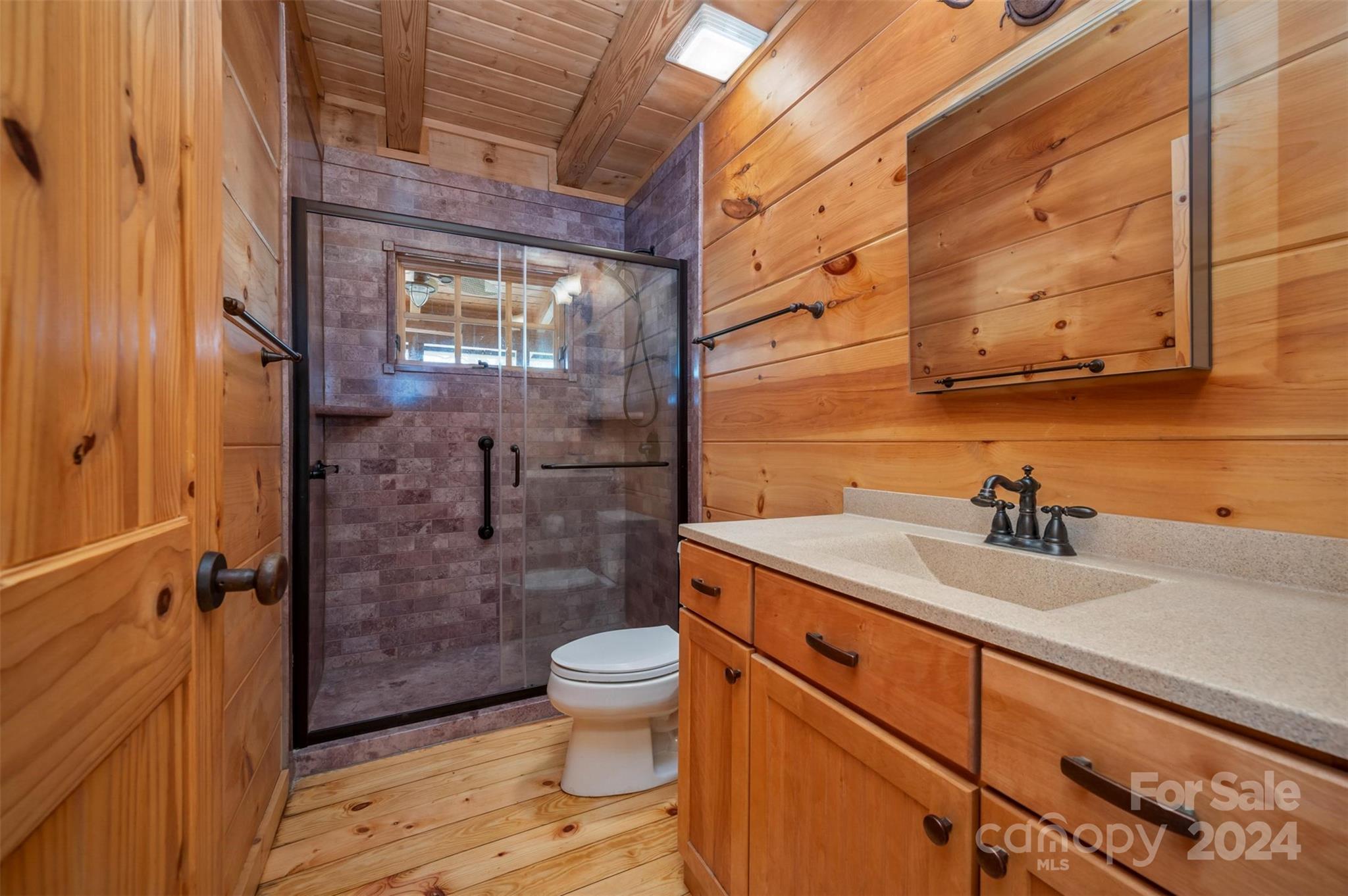 778 Pkwy N Road Mill Spring, NC 28756 - Photo 44 of 48 a bathroom with a sink a toilet and shower