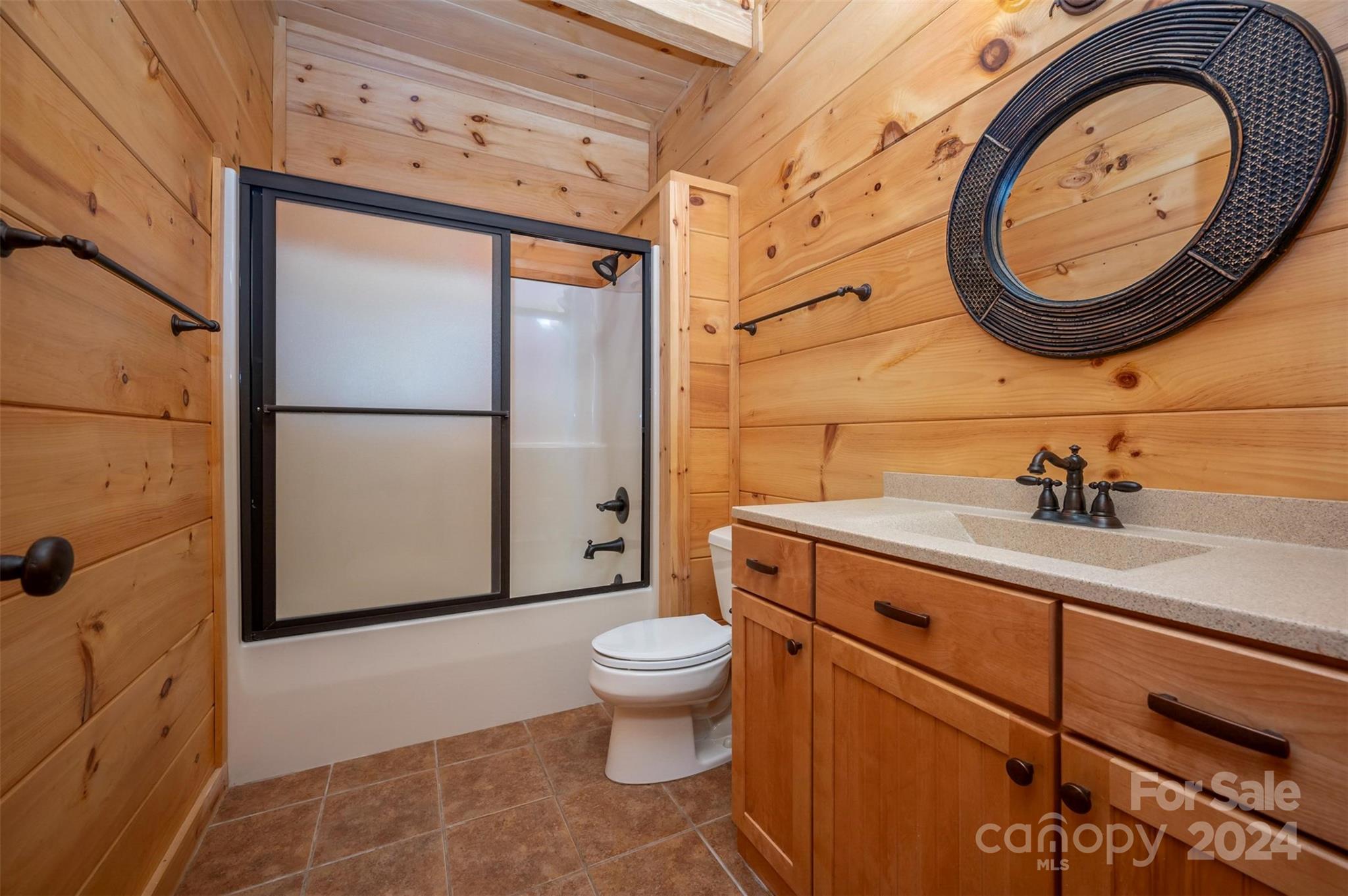 778 Pkwy N Road Mill Spring, NC 28756 - Photo 47 of 48 a bathroom with a toilet a sink and a mirror