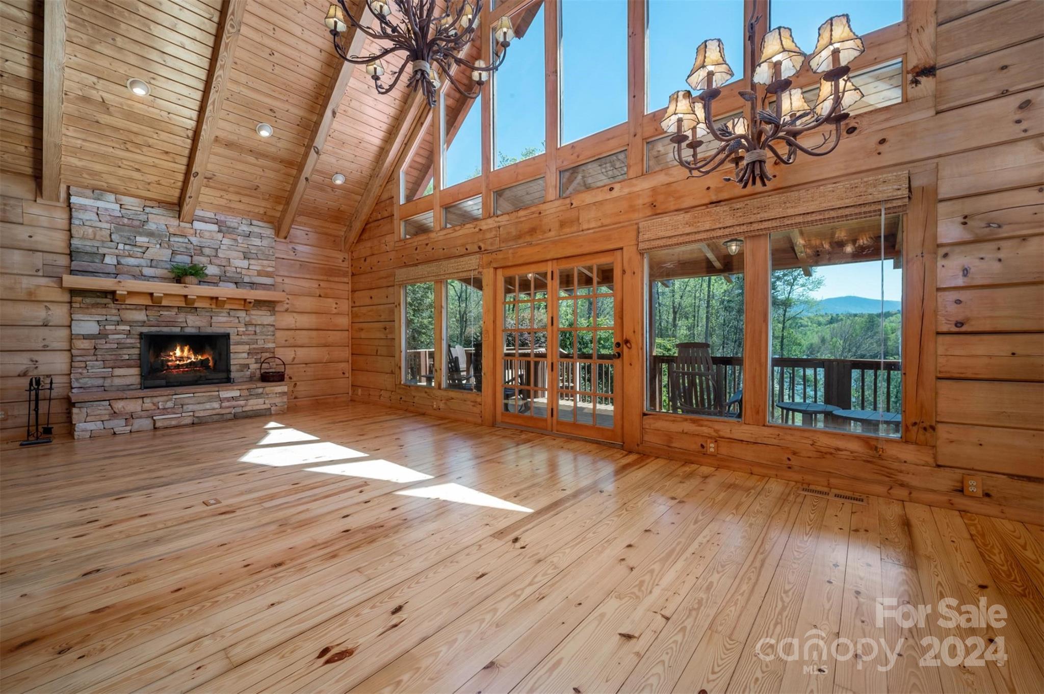 778 Pkwy N Road Mill Spring, NC 28756 - Photo 8 of 48 a view of an empty room with wooden floor and a fireplace