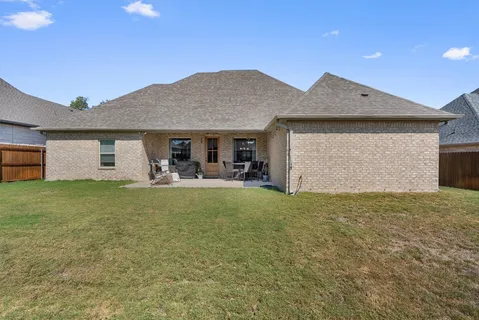 a front view of house with yard and porch