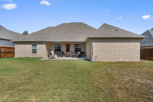 a front view of house with yard and porch