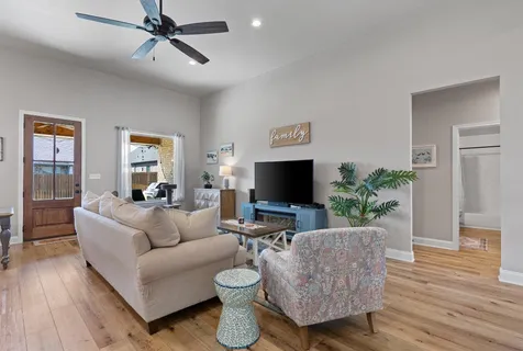 a living room with furniture and a flat screen tv
