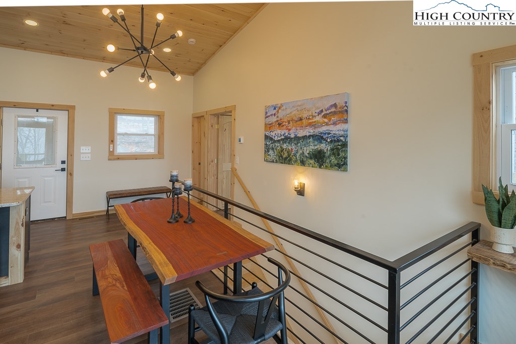 232 Wild Daisy Lane Beech Mountain, NC 28604 - Photo 12 of 49 a dining room with furniture and wooden floor