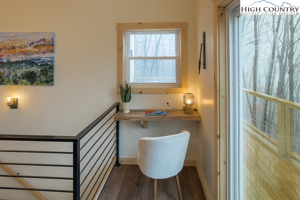 232 Wild Daisy Lane Beech Mountain, NC 28604 - Photo 13 of 49 a living room with furniture and a window