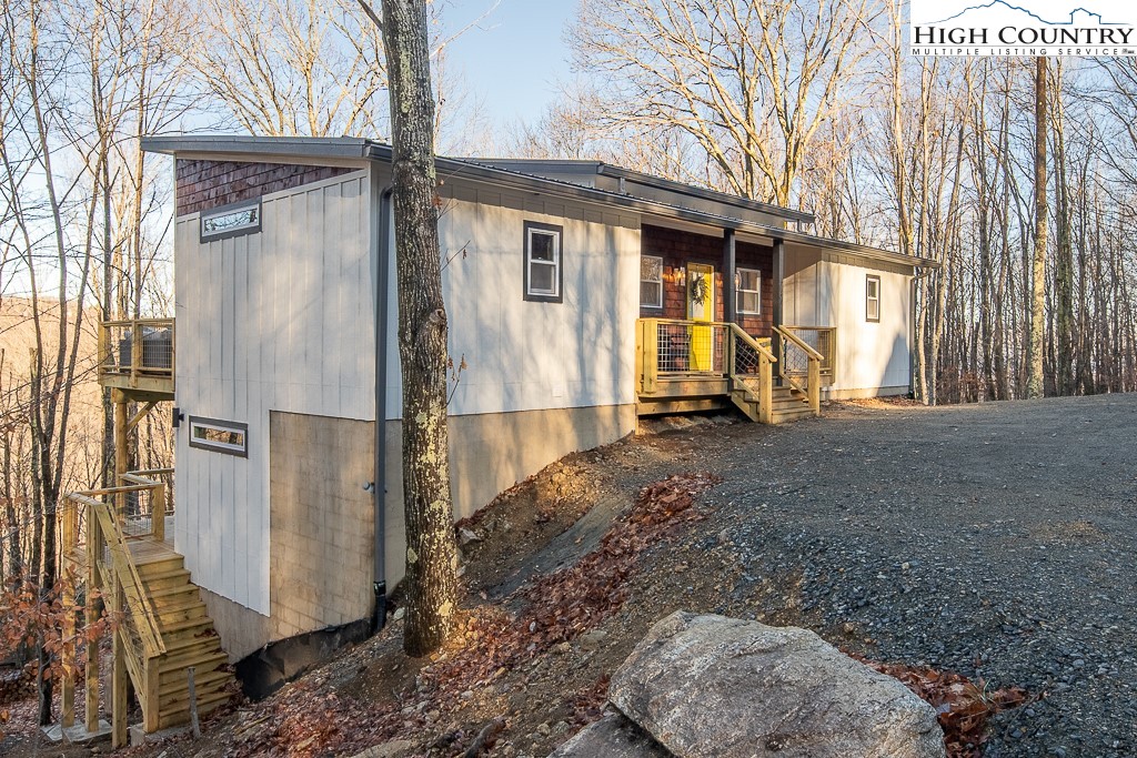 232 Wild Daisy Lane Beech Mountain, NC 28604 - Photo 2 of 49 a view of a house with backyard