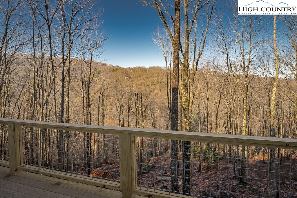 232 Wild Daisy Lane Beech Mountain, NC 28604 - Photo 24 of 49 a view of a balcony with an outdoor space