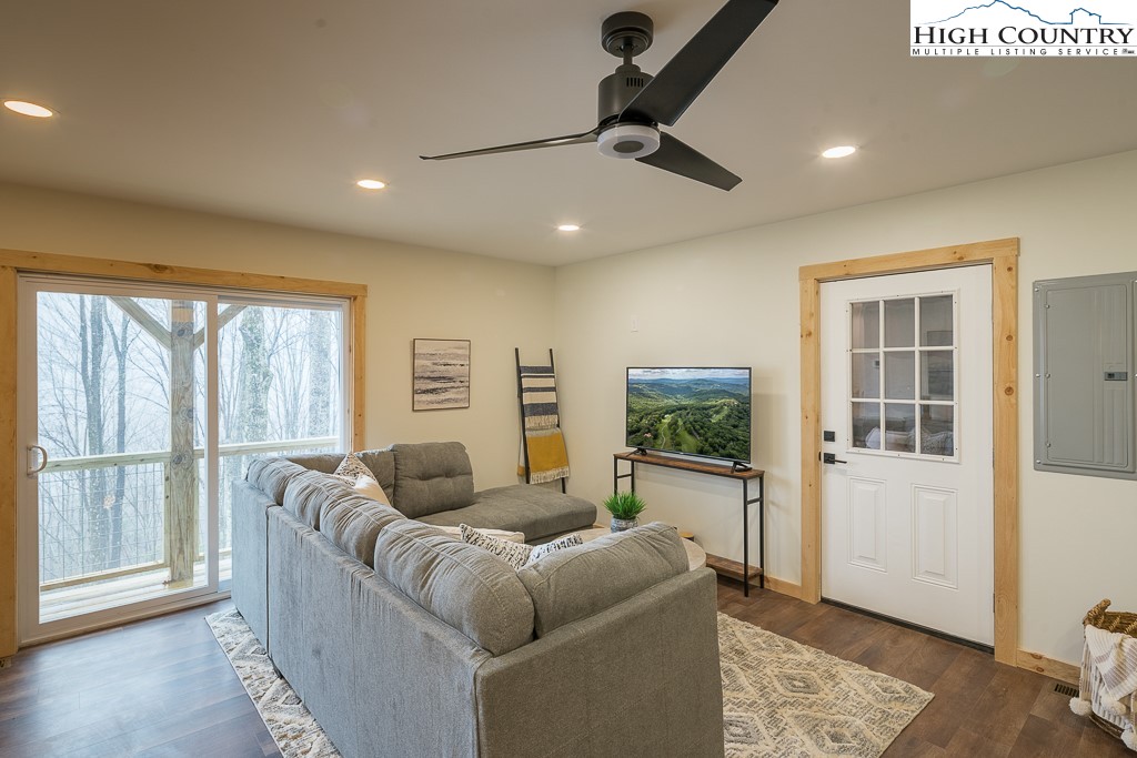 232 Wild Daisy Lane Beech Mountain, NC 28604 - Photo 31 of 49 a living room with furniture and a window