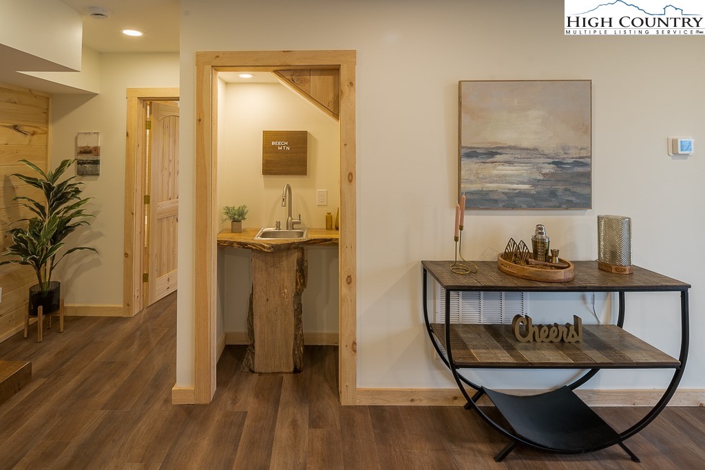 232 Wild Daisy Lane Beech Mountain, NC 28604 - Photo 32 of 49 a living room with furniture and a wooden floor