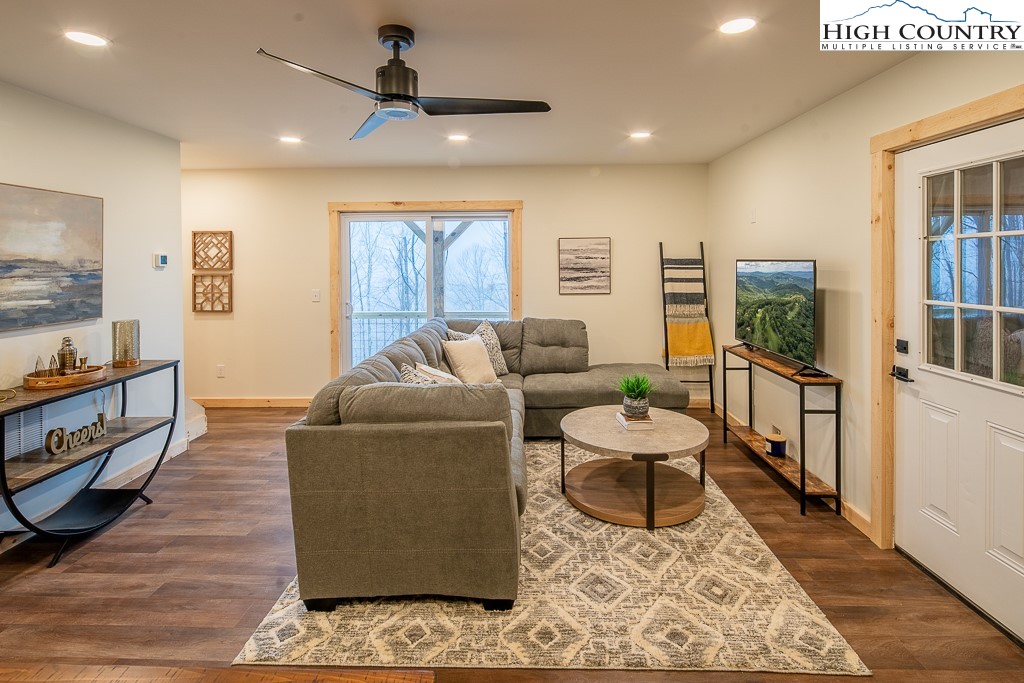 232 Wild Daisy Lane Beech Mountain, NC 28604 - Photo 34 of 49 a living room with furniture and a flat screen tv