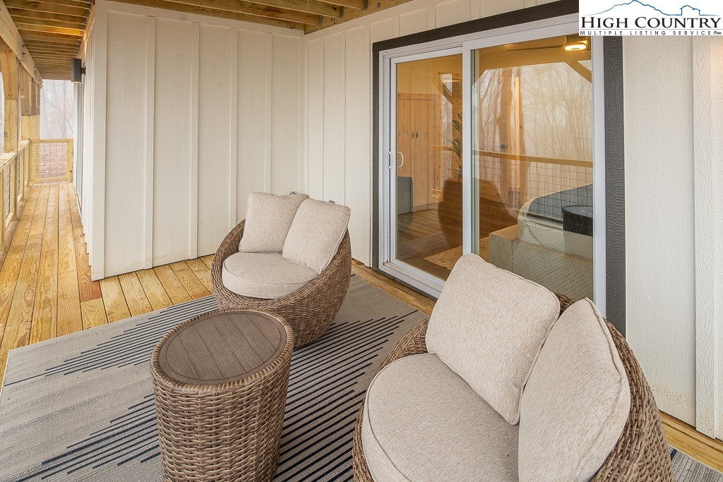 232 Wild Daisy Lane Beech Mountain, NC 28604 - Photo 43 of 49 a living room with furniture and a window