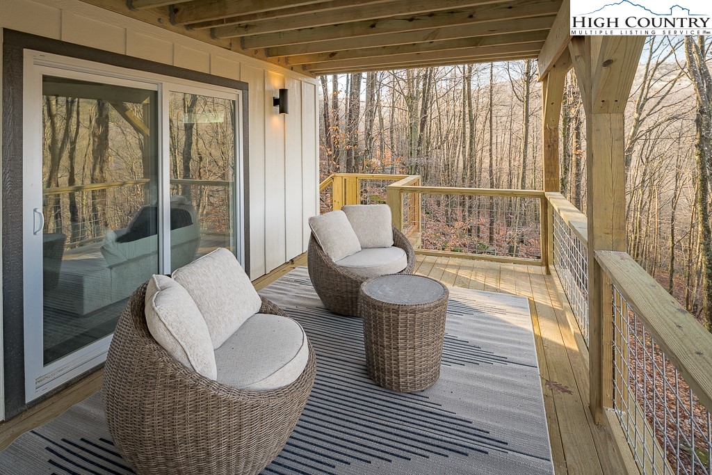 232 Wild Daisy Lane Beech Mountain, NC 28604 - Photo 44 of 49 a living room with furniture and a rug